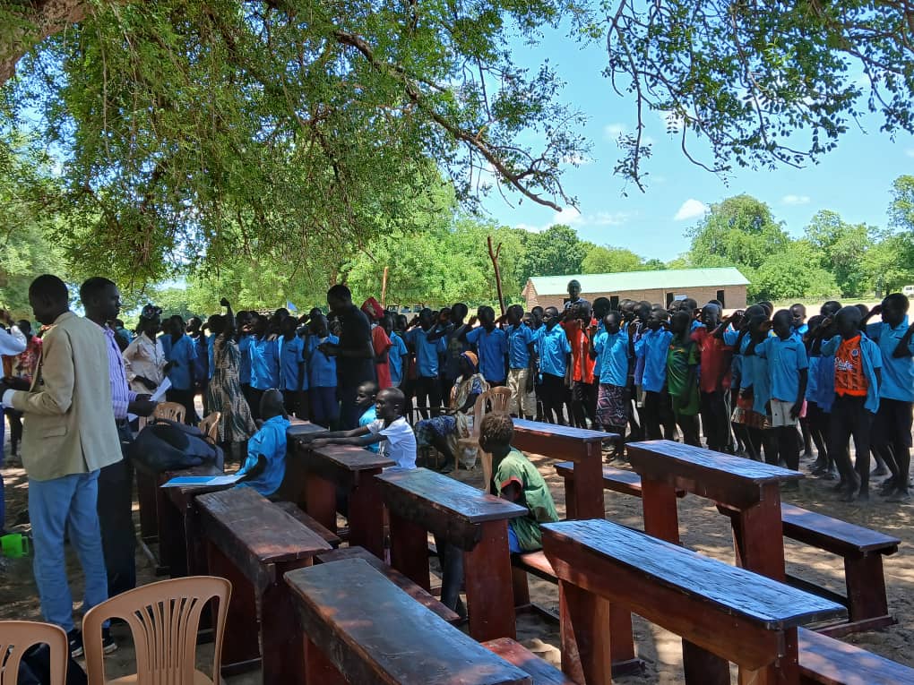 Students at RASI-built school showing the direct impact of donations