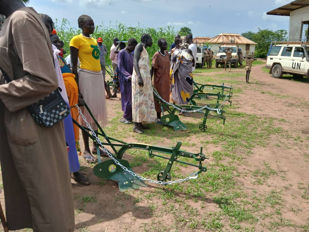 Protection & Livelihoods project - Community members examining ox-ploughs for distribution in Yirol East County